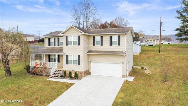 view of front of home featuring covered porch, a garage, and a front yard