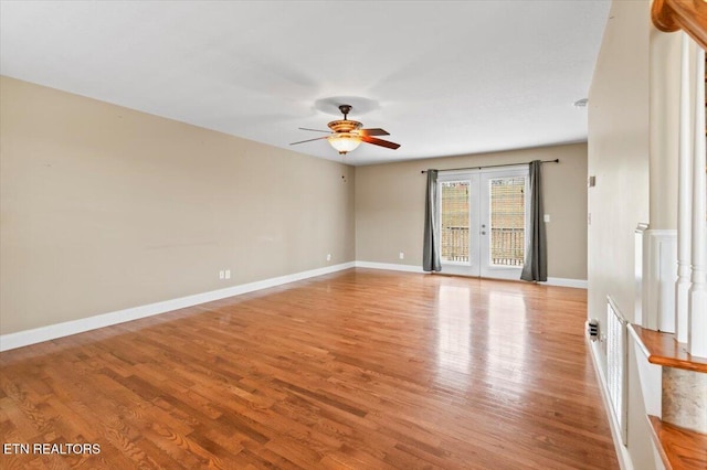 spare room with french doors, light hardwood / wood-style flooring, and ceiling fan