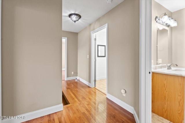 interior space featuring light hardwood / wood-style flooring and sink