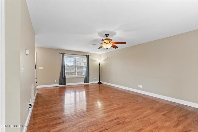 spare room featuring ceiling fan and light hardwood / wood-style floors