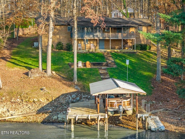 exterior space with a yard and a water view