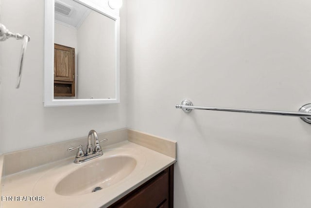 bathroom with vanity and ornamental molding