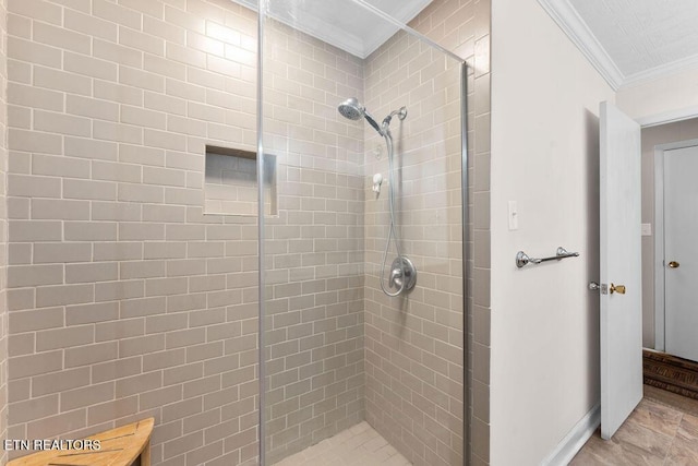 bathroom featuring a tile shower and ornamental molding