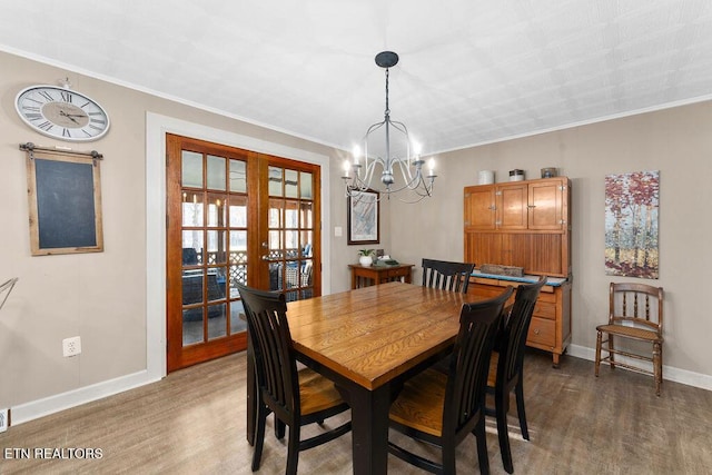 dining area featuring crown molding, french doors, and dark hardwood / wood-style floors