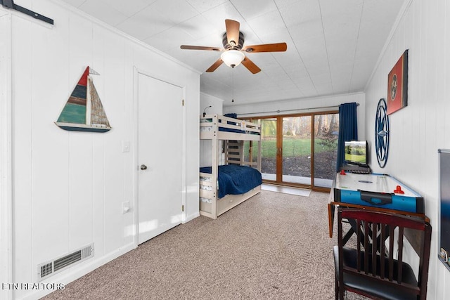 bedroom with ceiling fan, access to exterior, and crown molding