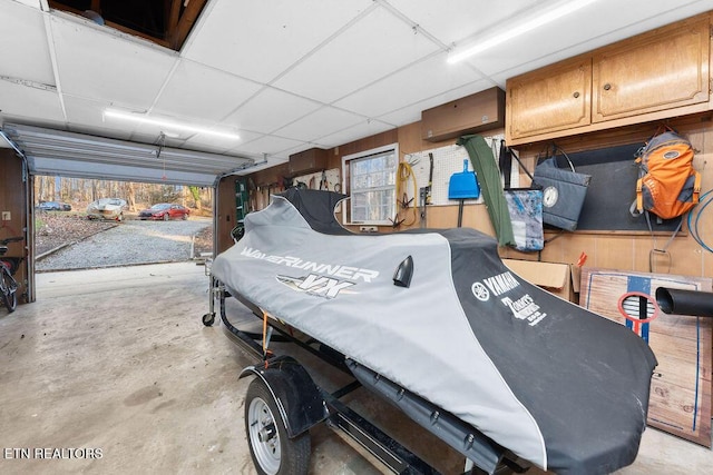 garage featuring wooden walls