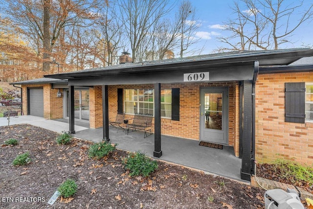 back of house with a garage