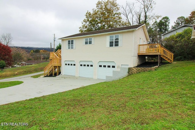 view of side of home featuring a garage, a lawn, and a wooden deck