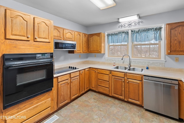 kitchen with sink and black appliances