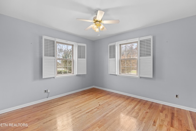 empty room with light hardwood / wood-style flooring and ceiling fan