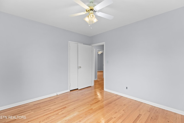 unfurnished room with ceiling fan and light hardwood / wood-style flooring