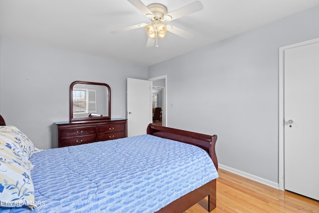 bedroom with ceiling fan and light hardwood / wood-style floors