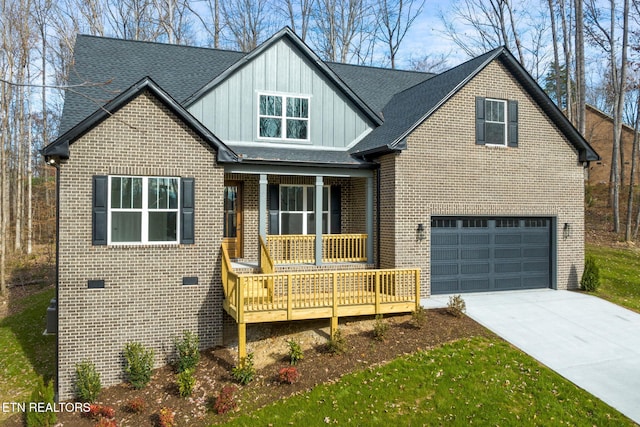 view of front of home featuring covered porch and a garage