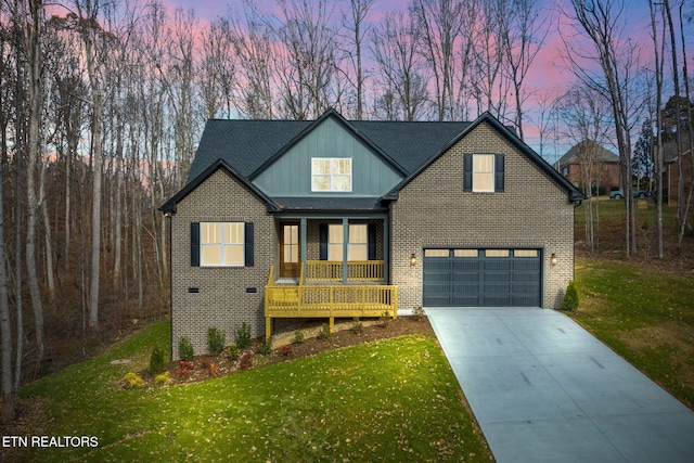 view of front facade with a lawn and a garage