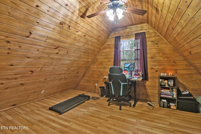 unfurnished office featuring wooden ceiling, wooden walls, vaulted ceiling, hardwood / wood-style flooring, and ceiling fan