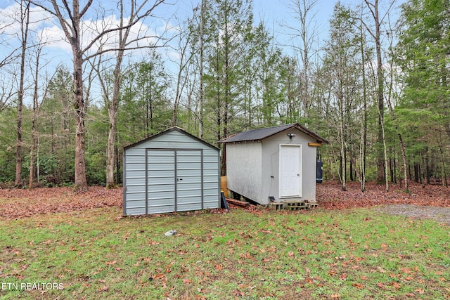 view of outdoor structure featuring a lawn