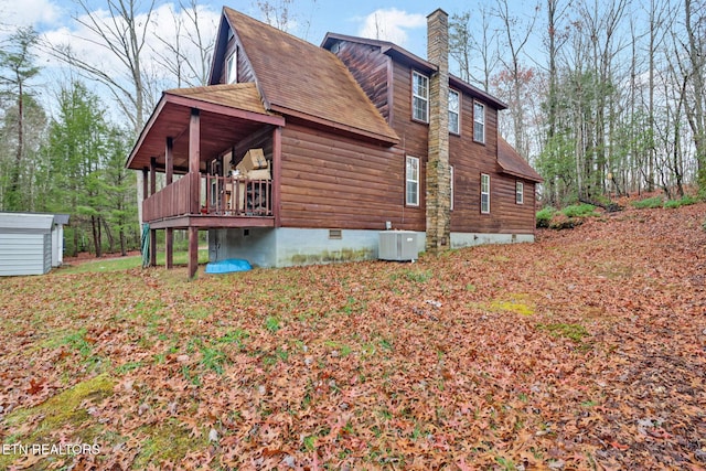 view of property exterior with central AC unit