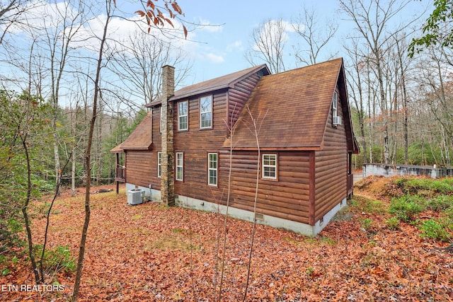 view of home's exterior with central AC unit