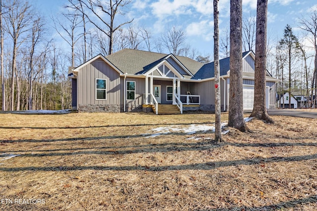 view of front of house featuring covered porch and a garage