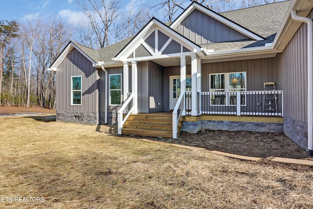 view of front facade with a front yard and a porch