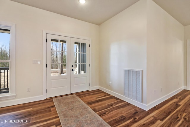 entryway featuring dark hardwood / wood-style floors and french doors