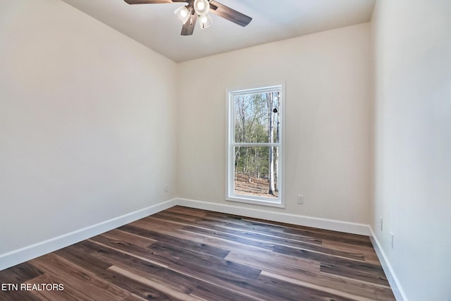 unfurnished room featuring ceiling fan and dark hardwood / wood-style flooring