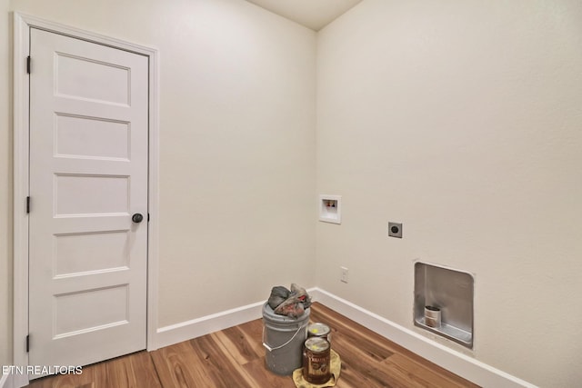 clothes washing area with hardwood / wood-style flooring, hookup for a washing machine, and electric dryer hookup