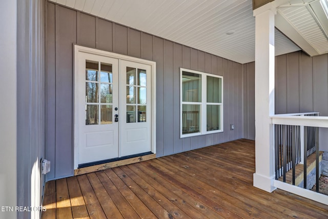 wooden deck featuring french doors