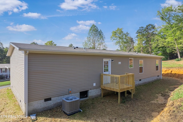 back of house with central AC