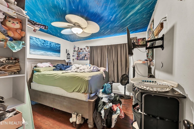 bedroom with ceiling fan and wood-type flooring