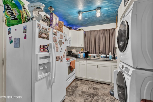 laundry room with a textured ceiling, sink, and stacked washer / dryer