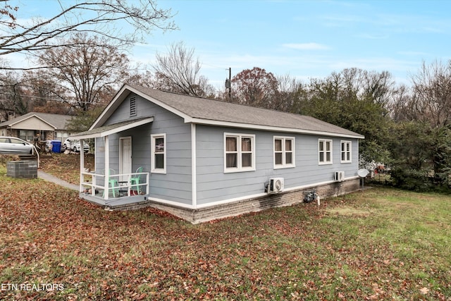 view of side of home with a lawn