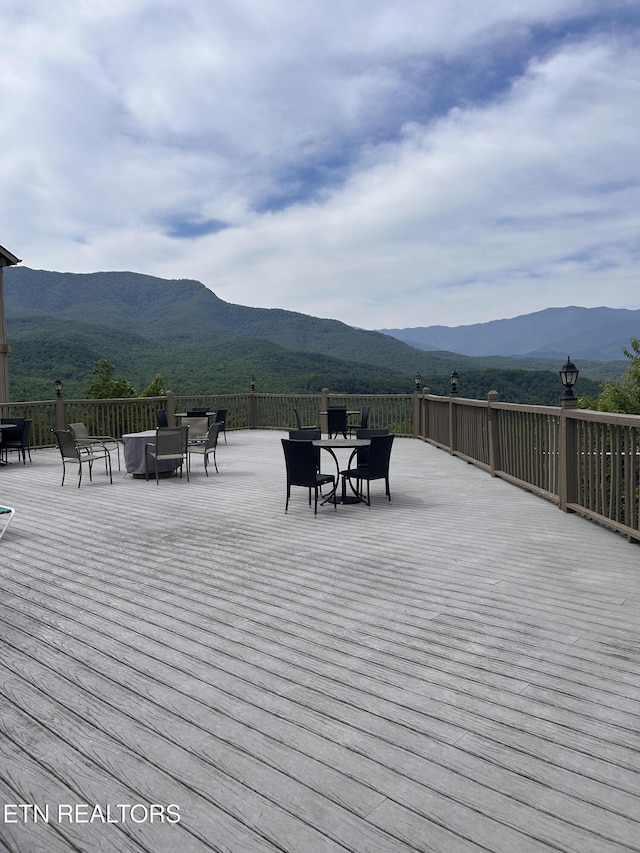 wooden terrace featuring a mountain view