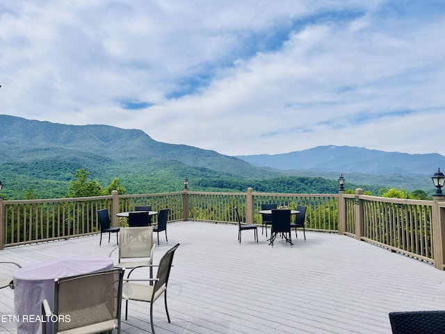 wooden terrace with a mountain view