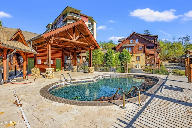 view of swimming pool featuring a patio area