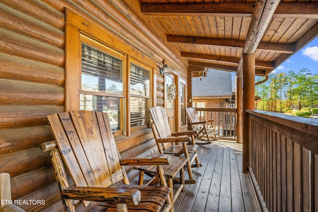 wooden terrace featuring covered porch