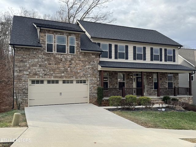 view of front of property featuring a garage and covered porch