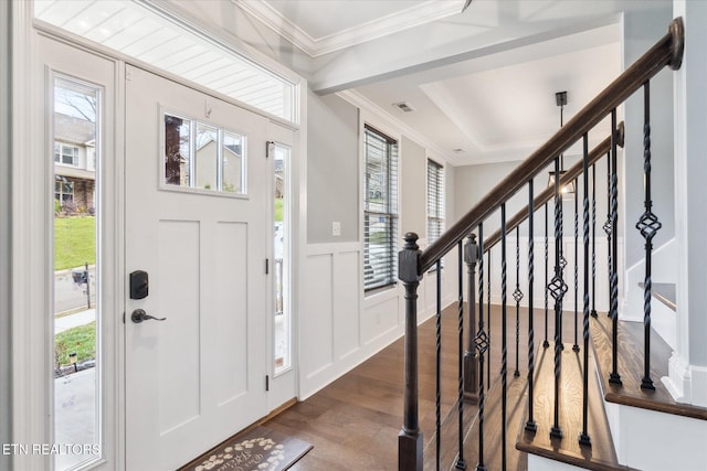 entryway featuring dark hardwood / wood-style flooring and ornamental molding