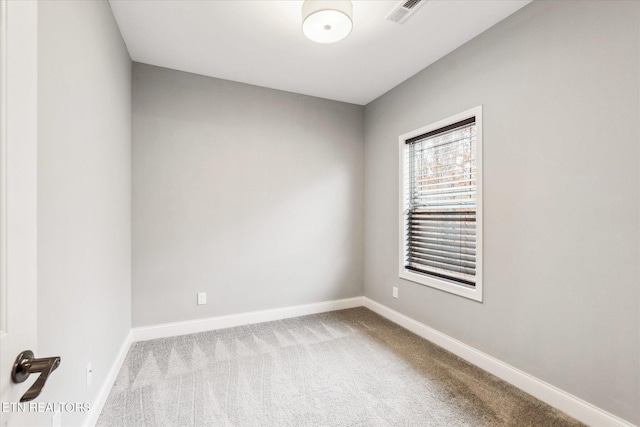 empty room featuring light carpet