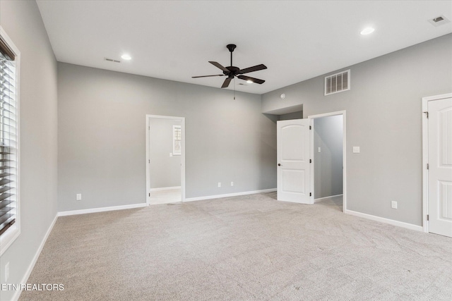 carpeted empty room with ceiling fan