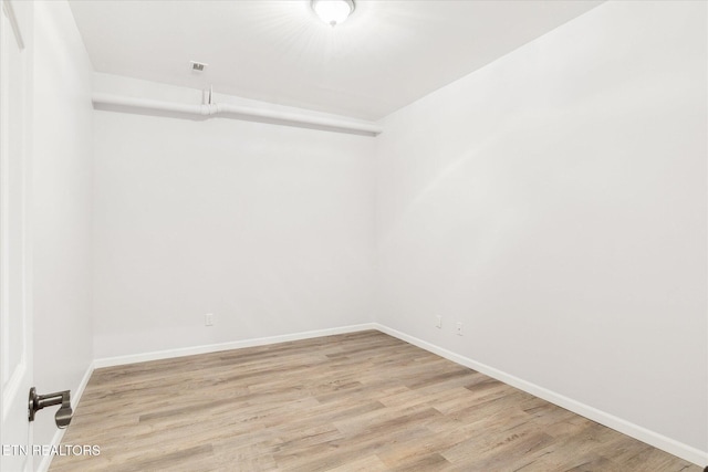 empty room with light wood-type flooring