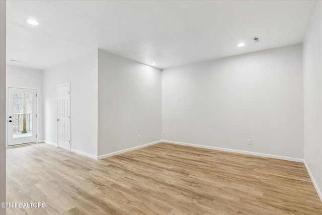 spare room featuring light hardwood / wood-style flooring