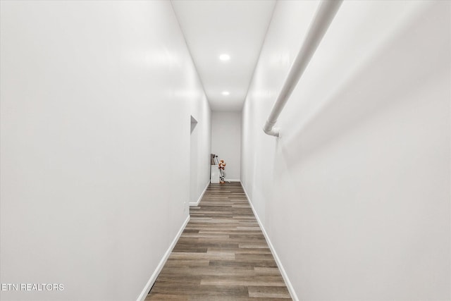 hall with wood-type flooring