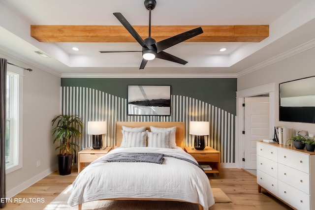 bedroom featuring recessed lighting, light wood-style flooring, and a tray ceiling