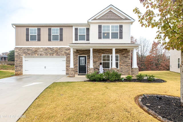 craftsman house featuring a front yard and a garage