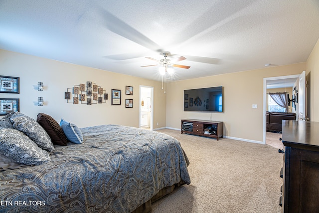 carpeted bedroom featuring a textured ceiling, ceiling fan, and connected bathroom