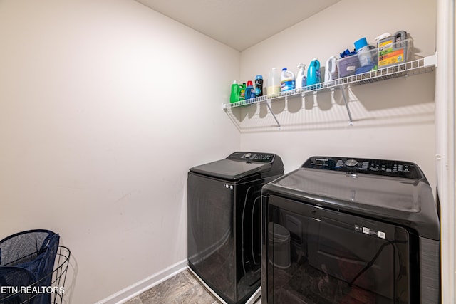 laundry area with hardwood / wood-style flooring and independent washer and dryer