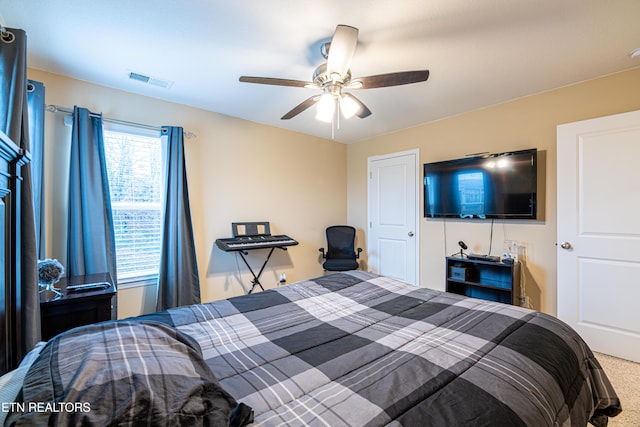 carpeted bedroom featuring ceiling fan