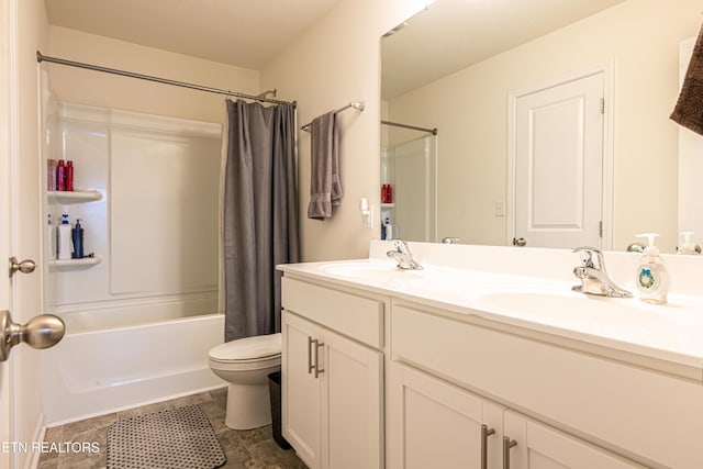 full bathroom featuring vanity, toilet, and shower / tub combo with curtain