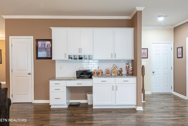 kitchen featuring white cabinets, dark hardwood / wood-style flooring, and light stone counters